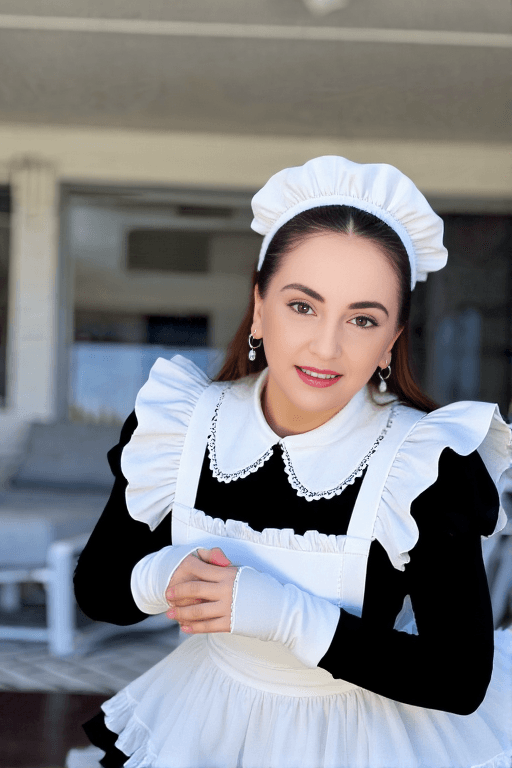 Hoopsy Daisy OnlyFans leaked fashion photo — This maid cosplay with a tiny black and white outfit, bending over with a feather duster, frilly thong visible is doing things to me