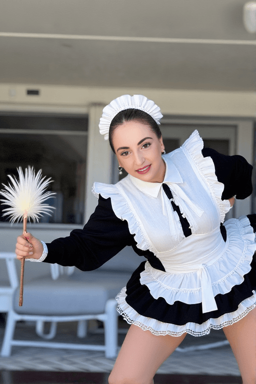 Hoopsy Daisy OnlyFans leaked fashion photo — That maid cosplay with a tiny black and white outfit, bending over with a feather duster, frilly thong visible look hits different